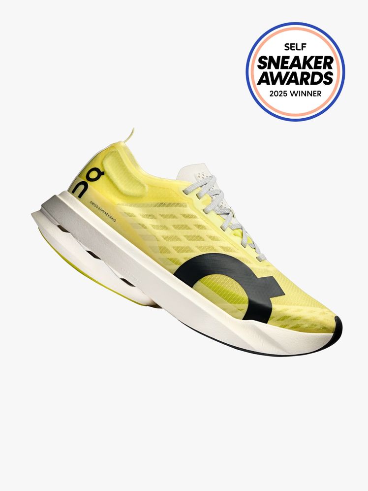 On Cloudboom Strike yellow sneaker on light gray background with SELF Sneaker Awards seal in the top right corner